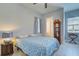 Bedroom with a queen bed, private bathroom, and water view at 15240 Spanish Point Dr, Port Charlotte, FL 33981