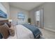 This bedroom is a serene retreat, with neutral colors, plenty of natural light, and modern accents at 15240 Spanish Point Dr, Port Charlotte, FL 33981