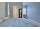 Bedroom with a queen bed, private bathroom access, and large window at 15240 Spanish Point Dr, Port Charlotte, FL 33981