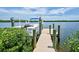 Pontoon boat at private dock on calm water at 15240 Spanish Point Dr, Port Charlotte, FL 33981