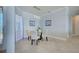 Dining room with modern chandelier and large windows providing lots of light at 15240 Spanish Point Dr, Port Charlotte, FL 33981