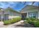 Front entry with walkway, landscaping, and bench at 15240 Spanish Point Dr, Port Charlotte, FL 33981