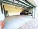 Two-car garage with epoxy flooring and ample storage at 15240 Spanish Point Dr, Port Charlotte, FL 33981