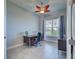 Home office with built-in desk and view to backyard at 15240 Spanish Point Dr, Port Charlotte, FL 33981