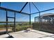 View of the screened-in pool area with a beautiful waterfront view at 15240 Spanish Point Dr, Port Charlotte, FL 33981