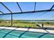 Relax in this screened-in pool area with lovely views of the waterway at 15240 Spanish Point Dr, Port Charlotte, FL 33981