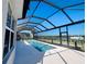 Enclosed heated pool with canal view and screened enclosure at 15240 Spanish Point Dr, Port Charlotte, FL 33981