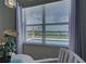 Window view showcases beautiful waterfront views, with a pool in the foreground at 15240 Spanish Point Dr, Port Charlotte, FL 33981