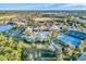 Aerial view of community amenities, including pool and tennis courts at 2555 Brassica Dr, North Port, FL 34289