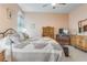 Main bedroom featuring a king-size bed and wood furniture at 2555 Brassica Dr, North Port, FL 34289