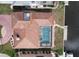 Aerial view of a home showcasing the private pool and dock, perfect for waterfront living at 56 Colony Point Dr, Punta Gorda, FL 33950