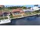 Beautiful waterfront home featuring a private dock and easy access to open water and a cozy screened-in porch at 56 Colony Point Dr, Punta Gorda, FL 33950