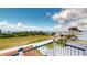 Balcony view of the ocean with lush landscape in the distance at 56 Colony Point Dr, Punta Gorda, FL 33950