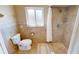 Bathroom featuring tile flooring, a walk-in shower, and toilet at 56 Colony Point Dr, Punta Gorda, FL 33950