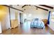 Airy bedroom with exposed beams, high ceilings, wood floors and access to canal view and bath at 56 Colony Point Dr, Punta Gorda, FL 33950