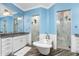 Luxurious Primary bathroom with a soaking tub and two walk-in showers at 1025 Cheshire St, Port Charlotte, FL 33953