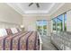 Main bedroom with pool view, large bed, and plenty of natural light at 1025 Cheshire St, Port Charlotte, FL 33953