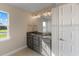 Modern bathroom with double vanity and granite countertop at 8136 Welsford Rd, Port Charlotte, FL 33981