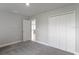 Spacious bedroom with double doors leading to the closet at 8136 Welsford Rd, Port Charlotte, FL 33981