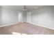 Spacious bedroom with ceiling fan and carpet flooring at 8136 Welsford Rd, Port Charlotte, FL 33981