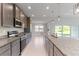 Modern kitchen with stainless steel appliances and an island at 8136 Welsford Rd, Port Charlotte, FL 33981