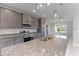 Granite countertop kitchen island with stainless steel appliances at 8136 Welsford Rd, Port Charlotte, FL 33981