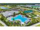 Aerial view of community with pool, pickleball, and bocce ball courts at 16423 Bridle Ridge St, Port Charlotte, FL 33953