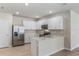 Modern kitchen with stainless steel appliances and an island at 16423 Bridle Ridge St, Port Charlotte, FL 33953