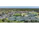 Aerial view of community tennis courts, clubhouse, and parking at 3332 Grand Vista Ct # 101, Port Charlotte, FL 33953