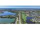 Aerial view of community with golf course and waterfront access at 3332 Grand Vista Ct # 101, Port Charlotte, FL 33953