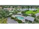 Community pool and homes with lush landscaping at 3332 Grand Vista Ct # 101, Port Charlotte, FL 33953