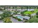 Community pool and homes with lush landscaping at 3332 Grand Vista Ct # 101, Port Charlotte, FL 33953