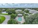 Community pool and homes with lush landscaping at 3332 Grand Vista Ct # 101, Port Charlotte, FL 33953