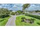 Community entrance with lush landscaping and signage at 3332 Grand Vista Ct # 101, Port Charlotte, FL 33953