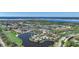 Aerial view of community near the waterfront with golf course at 3332 Grand Vista Ct # 101, Port Charlotte, FL 33953