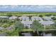 Aerial view of waterfront community with lush landscaping and golf course at 3332 Grand Vista Ct # 101, Port Charlotte, FL 33953