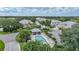 Community pool and homes with lush landscaping at 3332 Grand Vista Ct # 101, Port Charlotte, FL 33953