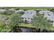 Aerial view showcasing a condo building near water at 3332 Grand Vista Ct # 101, Port Charlotte, FL 33953