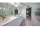 Spa-like bathroom with double vanity, large mirror, and garden tub at 3332 Grand Vista Ct # 101, Port Charlotte, FL 33953