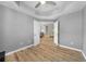 Light-filled bedroom with wood-look floors and access to living area at 3332 Grand Vista Ct # 101, Port Charlotte, FL 33953