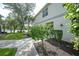 Condo entrance with lush landscaping and walkway at 3332 Grand Vista Ct # 101, Port Charlotte, FL 33953