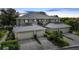 Attractive three-unit building, featuring attached garages and lush landscaping at 3332 Grand Vista Ct # 101, Port Charlotte, FL 33953