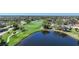 Golf course with pond and surrounding houses at 3332 Grand Vista Ct # 101, Port Charlotte, FL 33953