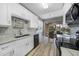 Modern kitchen with white cabinets and quartz countertops at 3332 Grand Vista Ct # 101, Port Charlotte, FL 33953