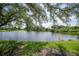 Serene view of a lake with lush greenery at 3332 Grand Vista Ct # 101, Port Charlotte, FL 33953