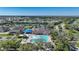 Community pool with lounge chairs and surrounding landscaping at 3332 Grand Vista Ct # 101, Port Charlotte, FL 33953