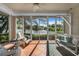 Relaxing screened porch overlooking a tranquil lake at 3332 Grand Vista Ct # 101, Port Charlotte, FL 33953