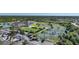 Aerial view of community tennis courts and clubhouse at 3332 Grand Vista Ct # 101, Port Charlotte, FL 33953