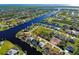 Aerial view of property showcasing canal front location in a neighborhood with waterfront access at 9310 Rosebud Cir, Port Charlotte, FL 33981