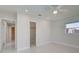 Light-filled bedroom with tile flooring, ceiling fan, and closet is a comfortable and private retreat at 9310 Rosebud Cir, Port Charlotte, FL 33981